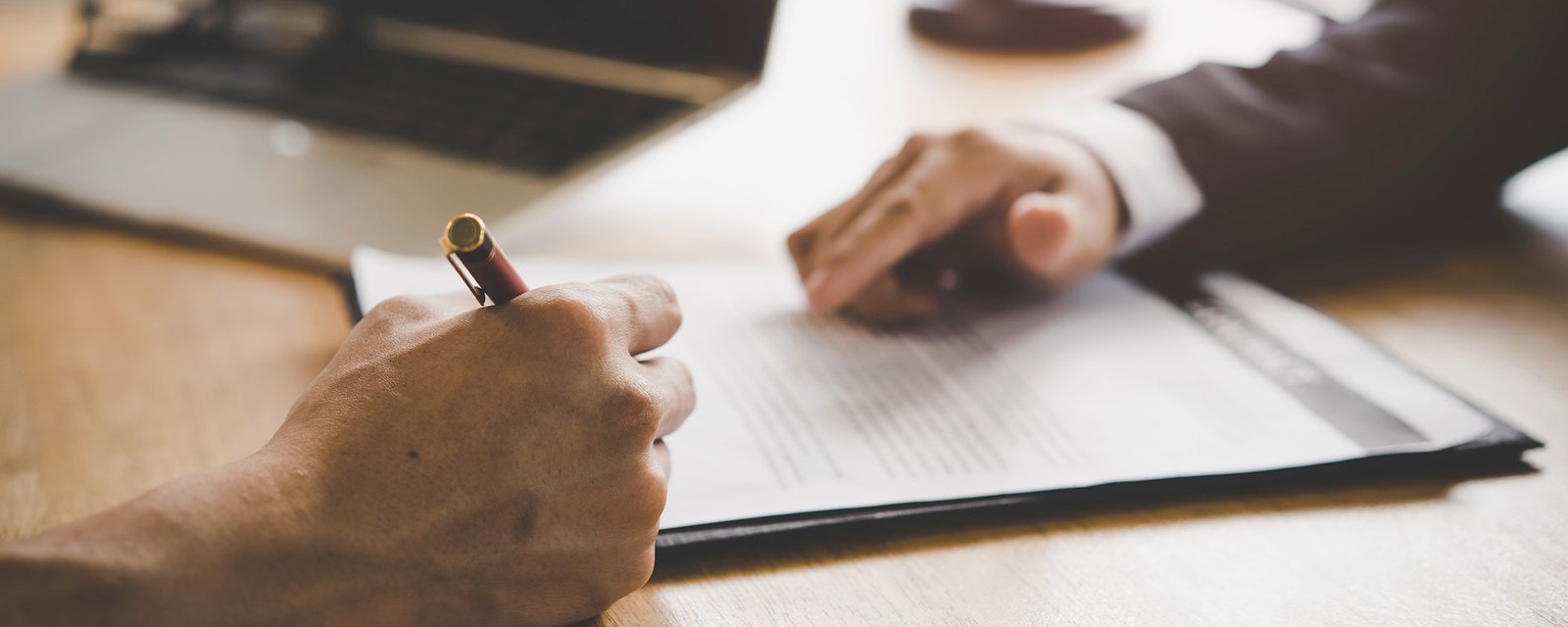 Lawyer consulting to client before sign business contract in the office.